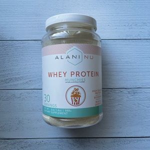 alani nu munchies p r o t e i n p o w d e r 🖤